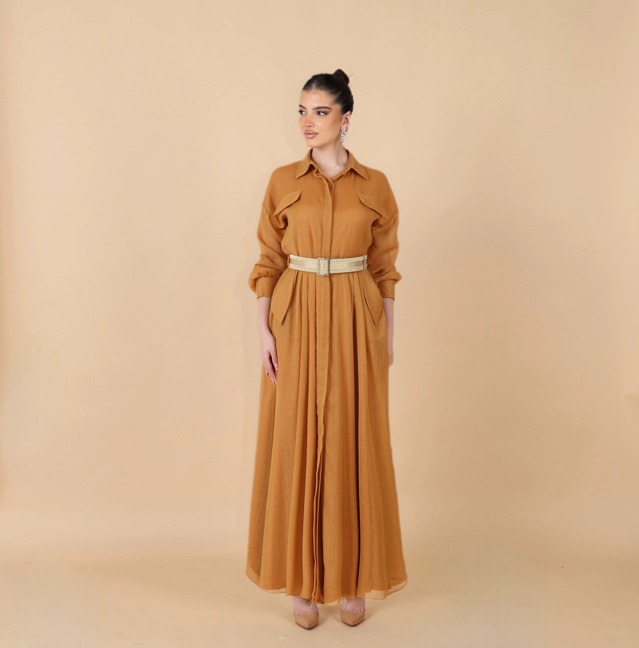 Honey-colored dress with a traditional touch, made from men's bisht and tieb wool