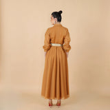 Honey-colored dress with a traditional touch, made from men's bisht and tieb wool