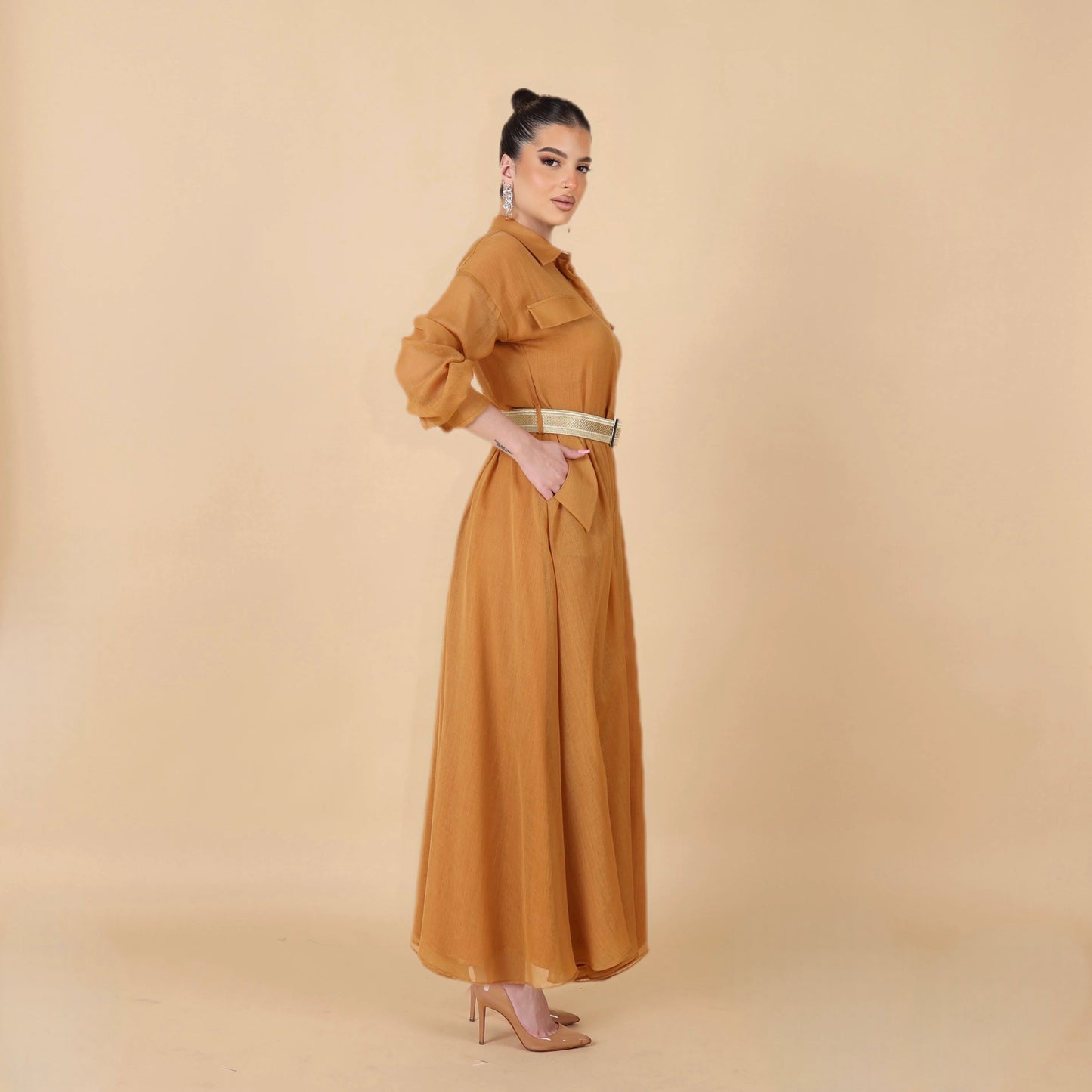 Honey-colored dress with a traditional touch, made from men's bisht and tieb wool